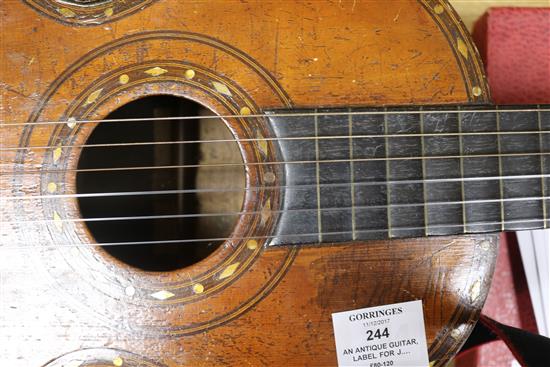 An antique guitar, label for J. Turner